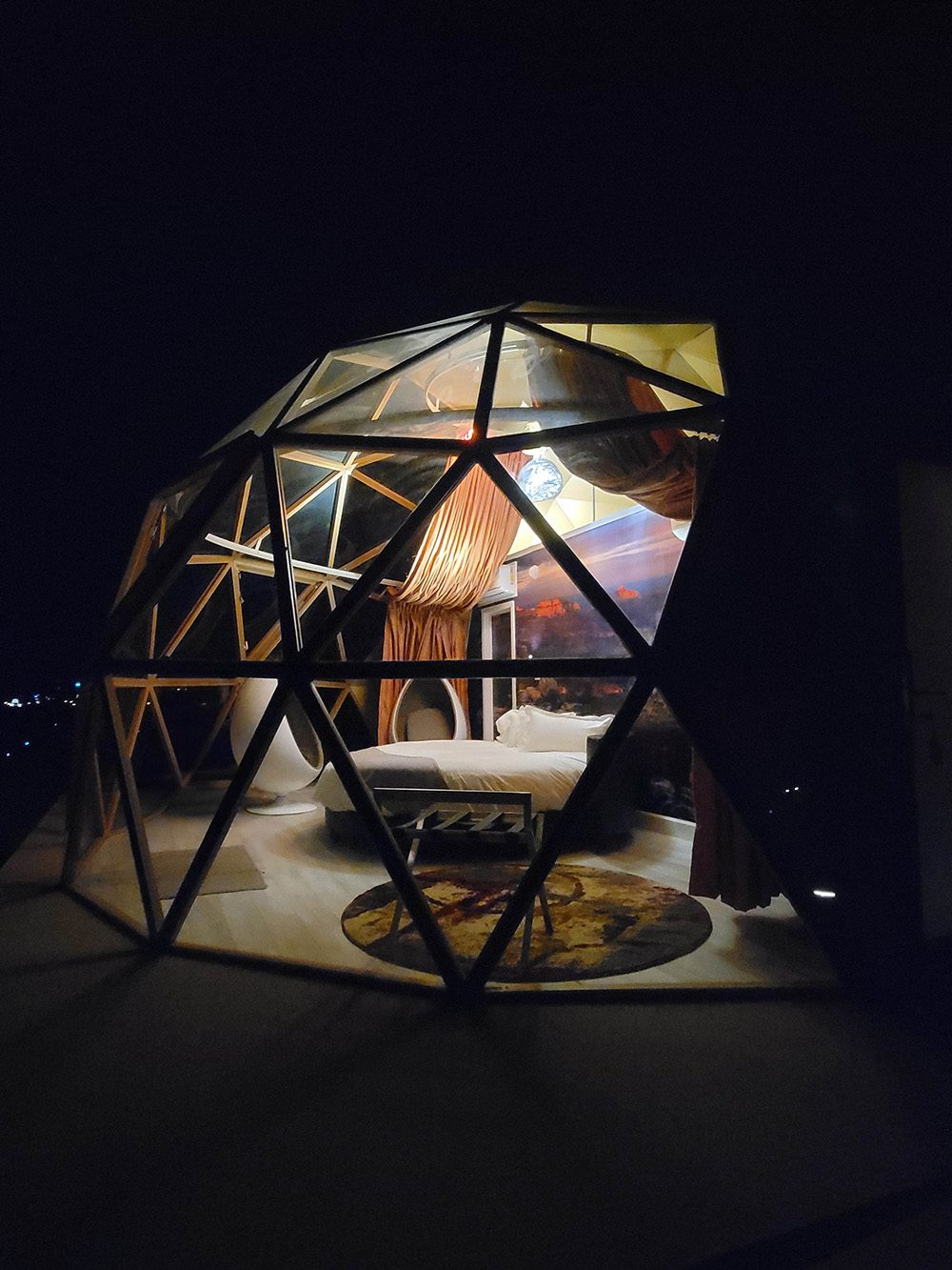 A large dome lit at night